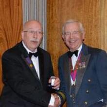 Peter Helmore receives his bar to the Award of Merit in Gold